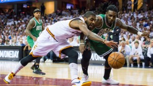 CLEVELAND, OH - APRIL 19: Kyrie Irving #2 of the Cleveland Cavaliers fights for a rebound with Jae Crowder #99 of the Boston Celtics in the first half during Game One in the Eastern Conference Quarterfinals of the 2015 NBA Playoffs 2015 at Quicken Loans Arena on April 19, 2015 in Cleveland, Ohio. NOTE TO USER: User expressly acknowledges and agrees that, by downloading and or using this photograph, User is consenting to the terms and conditions of the Getty Images License Agreement. (Photo by Jason Miller/Getty Images)