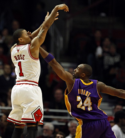 Chicago Bulls point guard Derrick Rose (1) follows through on a shot as Los Angeles Lakers shooting guard Kobe Bryant (24) defends with a hand in his face as the Chicago Bulls defeat the Los Angeles Lakers 88-84 at the United Center on Saturday, Dec. 10, 2010. (Brian Cassella/ Chicago Tribune) B58797767Z.1 ....OUTSIDE TRIBUNE CO.- NO MAGS, NO SALES, NO INTERNET, NO TV, NEW YORK TIMES OUT, CHICAGO OUT, NO DIGITAL MANIPULATION... (basketball pro)