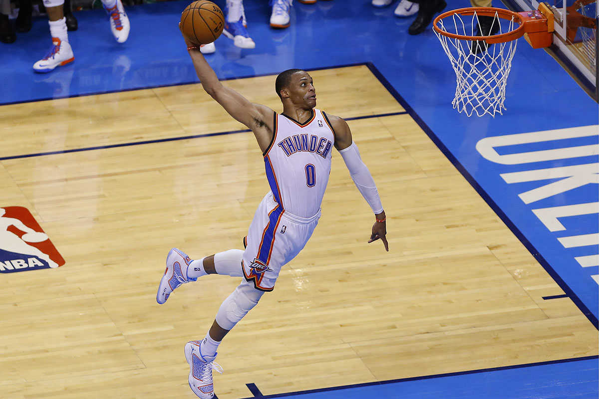 May 25, 2014; Oklahoma City, OK, USA; Oklahoma City Thunder guard Russell Westbrook (0) goes up for a dunk against the San Antonio Spurs in game three of the Western Conference Finals of the 2014 NBA Playoffs at Chesapeake Energy Arena. Oklahoma City won 106-97. Mandatory Credit: Alonzo Adams-USA TODAY SportsCODE: X02835